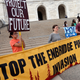 Tribal and environmental groups opposed to the Enbridge Line 3 project rally September 28, 2017, at the State Capitol in Minnesota. Photo: AP